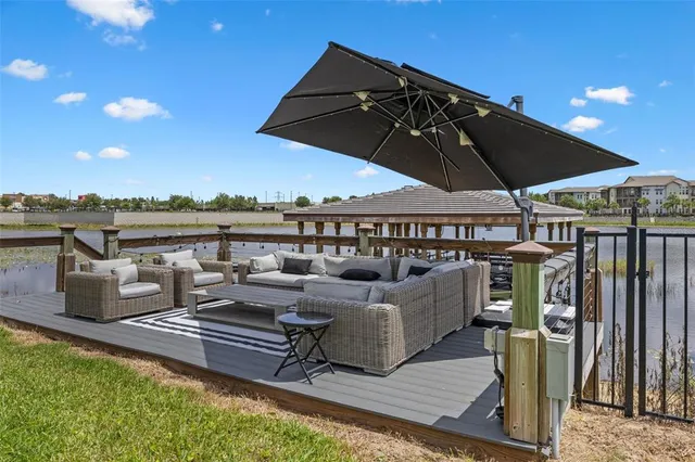 a bed room with a bed and a chair