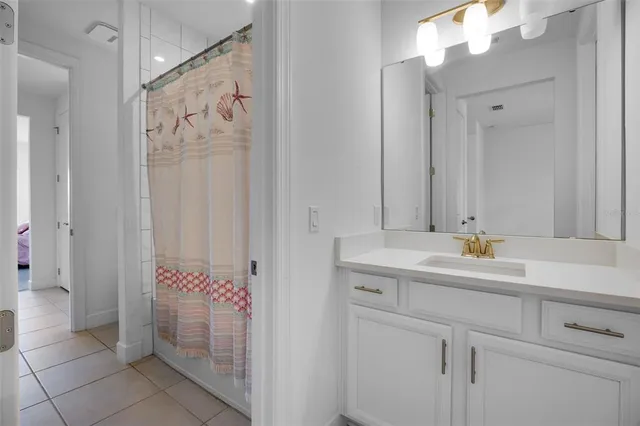 a bathroom with a sink mirror and toilet