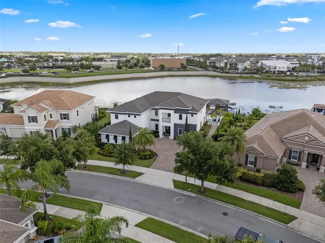an aerial view of a city with lake view