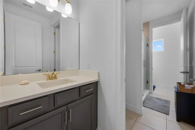 a kitchen with a sink a counter space appliances and wooden floor