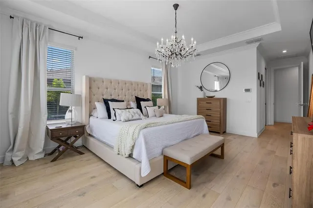 a front view of multiple houses with yard