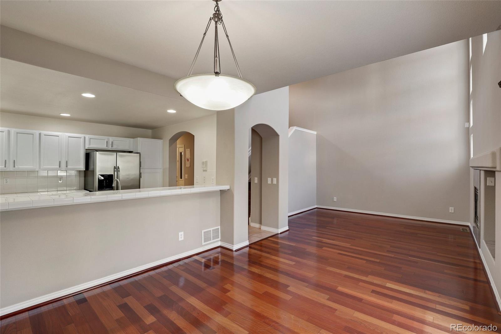 6677 South Forest Way, Unit D Centennial, CO 80121 - Photo 12 of 35 a view of a kitchen with a sink and a refrigerator