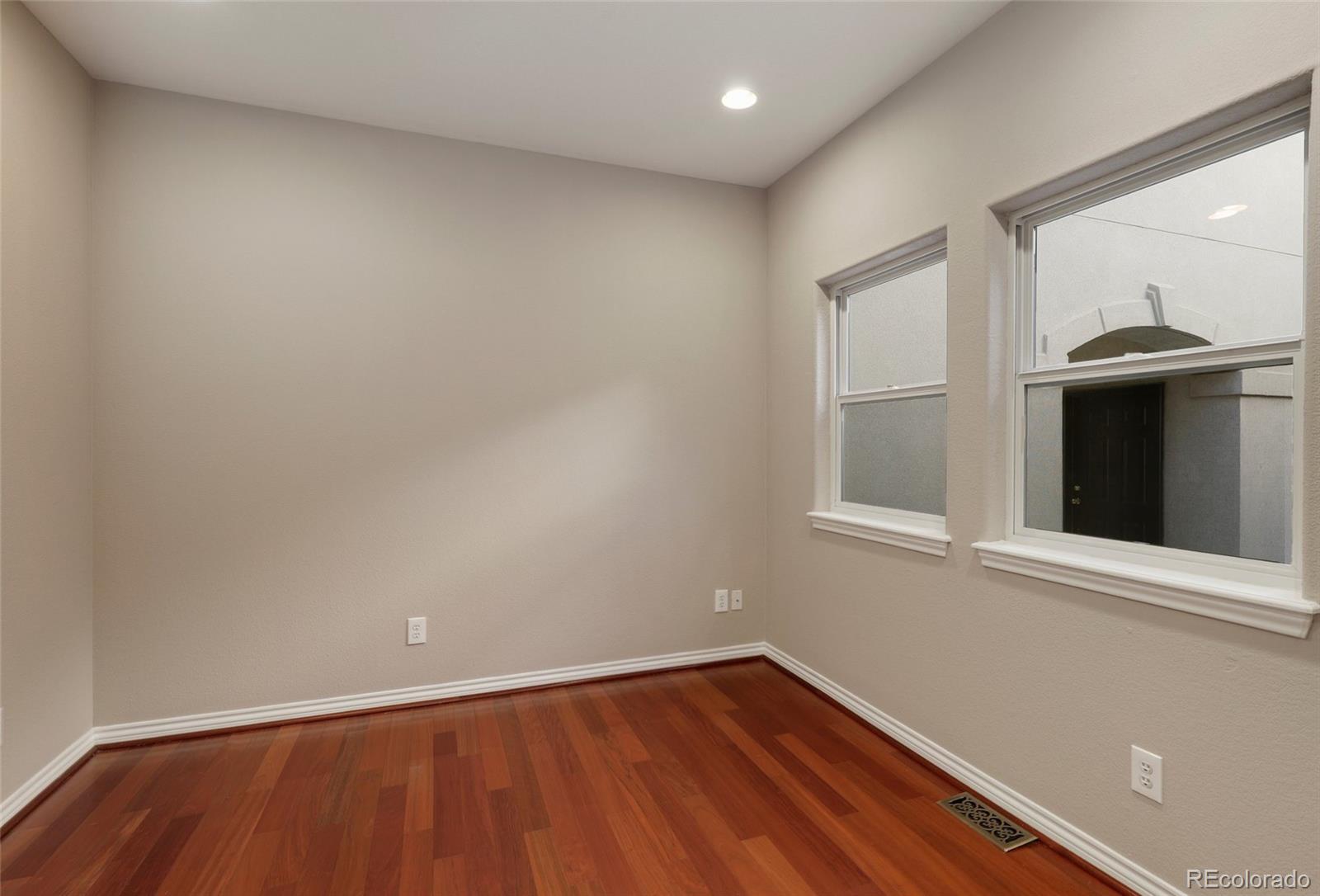 6677 South Forest Way, Unit D Centennial, CO 80121 - Photo 17 of 35 a view of an empty room with wooden floor