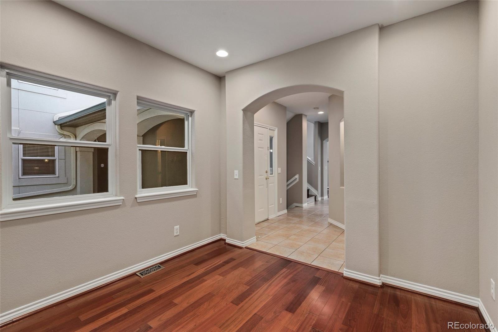 6677 South Forest Way, Unit D Centennial, CO 80121 - Photo 18 of 35 a view of a room with wooden floor and window