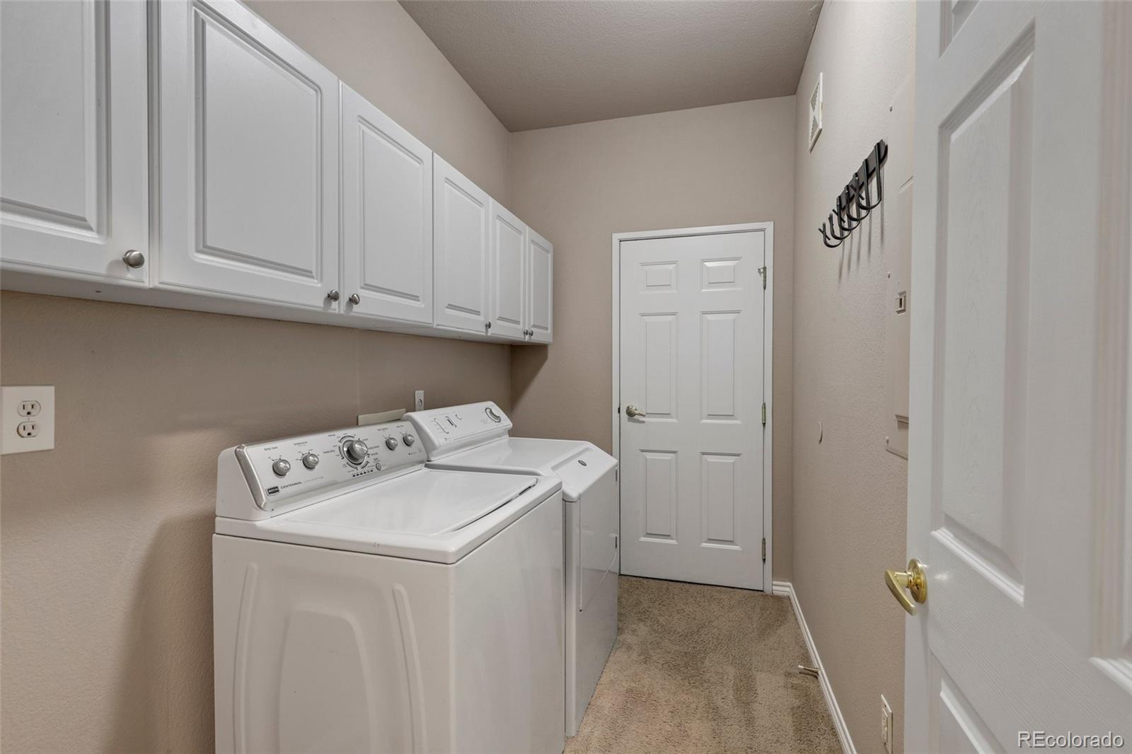 6677 South Forest Way, Unit D Centennial, CO 80121 - Photo 20 of 35 a utility room with dryer and washer