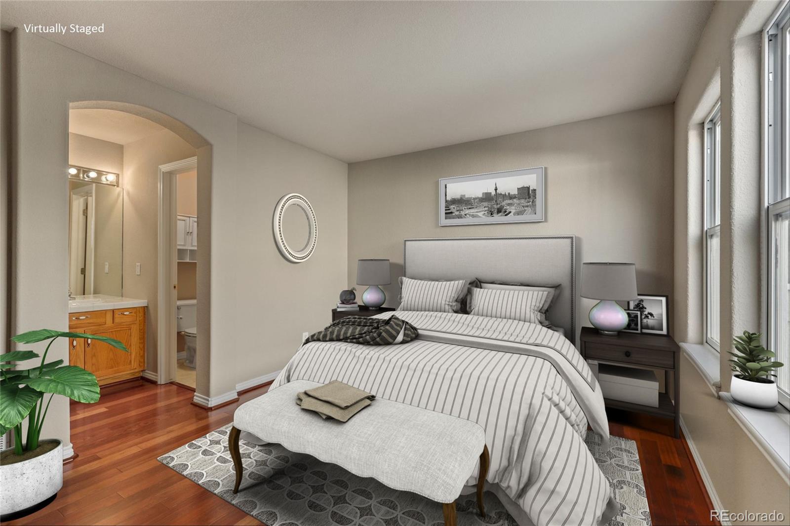 6677 South Forest Way, Unit D Centennial, CO 80121 - Photo 5 of 35 a bedroom with a bed and wooden floor