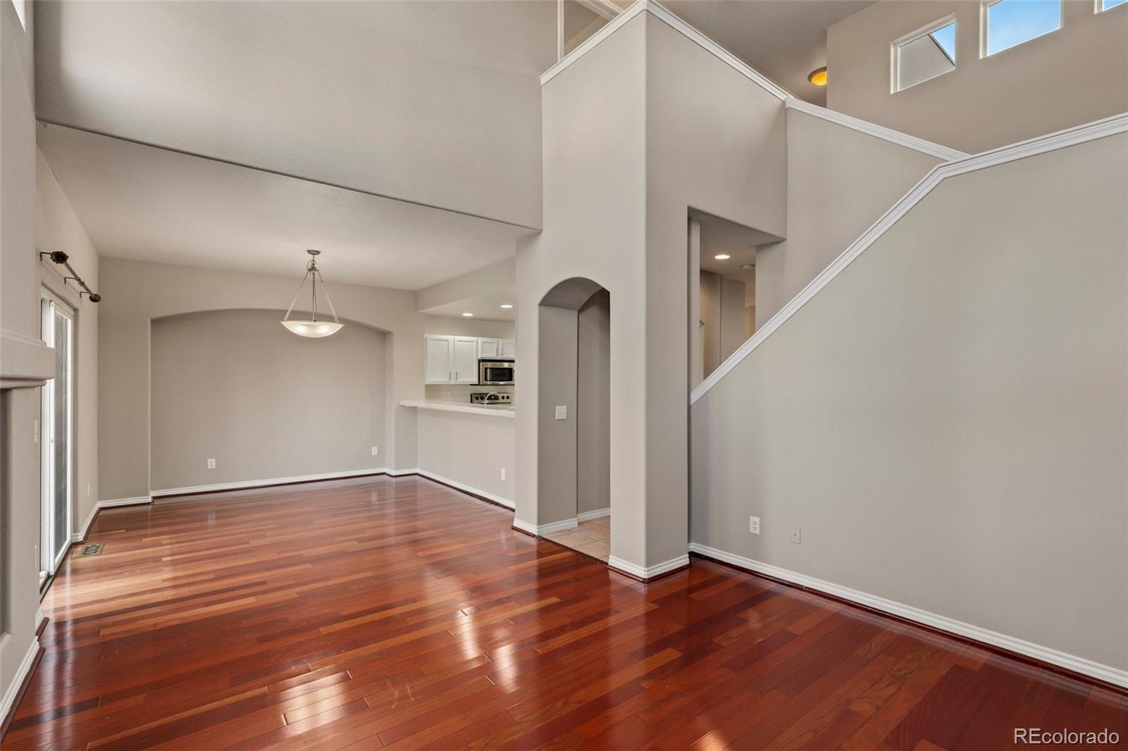 6677 South Forest Way, Unit D Centennial, CO 80121 - Photo 9 of 35 a view of empty room with wooden floor