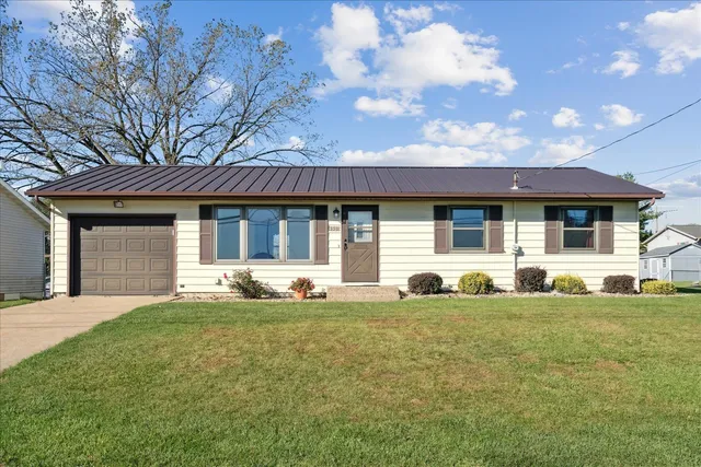 a front view of a house with a yard