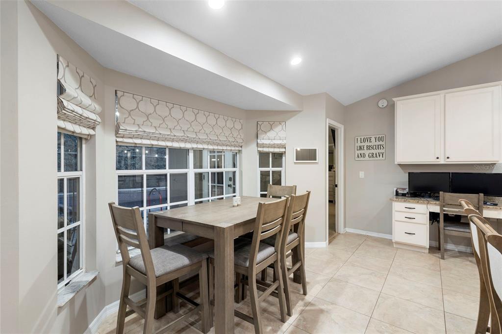 1777 Seneca Boulevard Winter Springs, FL 32708 - Photo 15 of 42 a view of a dining room with furniture and a window