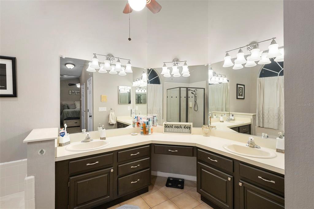 1777 Seneca Boulevard Winter Springs, FL 32708 - Photo 23 of 42 a bathroom with a double vanity sink and a mirror