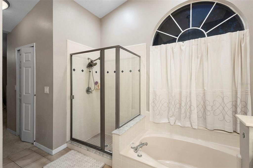 1777 Seneca Boulevard Winter Springs, FL 32708 - Photo 24 of 42 a bathroom with a bathtub and a shower