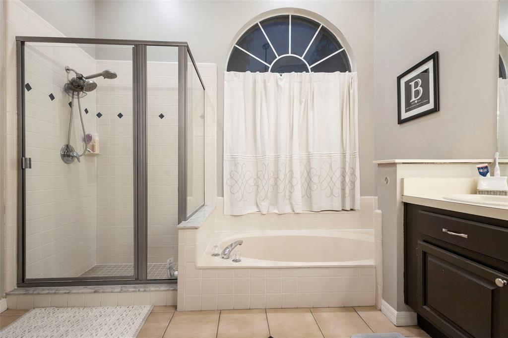 1777 Seneca Boulevard Winter Springs, FL 32708 - Photo 25 of 42 a bathroom with a tub sink and shower