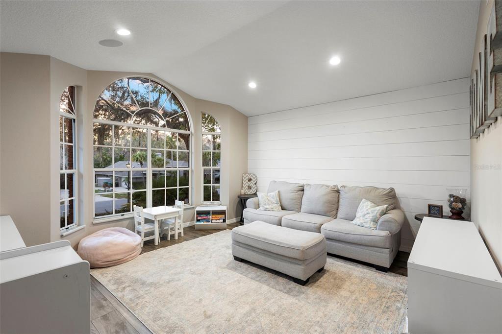 1777 Seneca Boulevard Winter Springs, FL 32708 - Photo 3 of 42 a living room with furniture and a large window