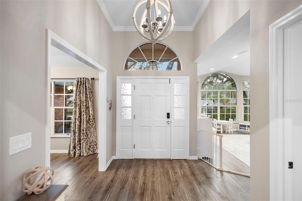 1777 Seneca Boulevard Winter Springs, FL 32708 - Photo 4 of 42 a view of empty room with wooden floor and fan