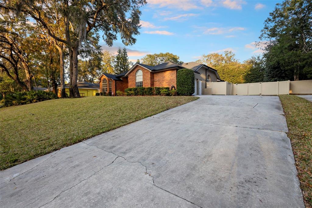 1777 Seneca Boulevard Winter Springs, FL 32708 - Photo 41 of 42 a front view of a house with a yard and garage