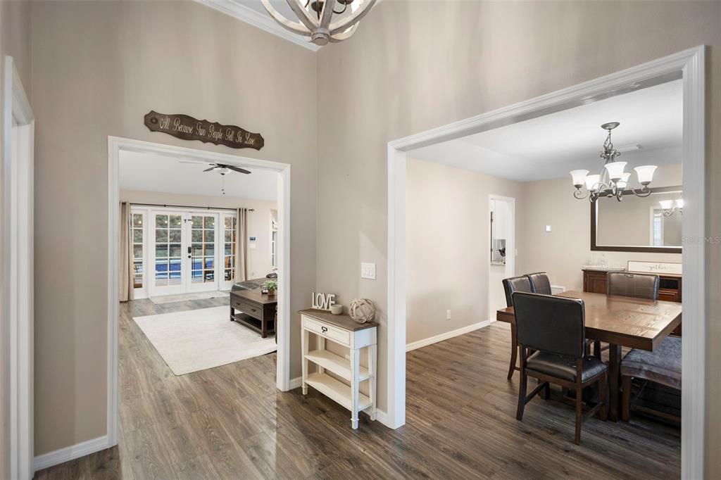 1777 Seneca Boulevard Winter Springs, FL 32708 - Photo 7 of 42 a view of a dining room with furniture and wooden floor