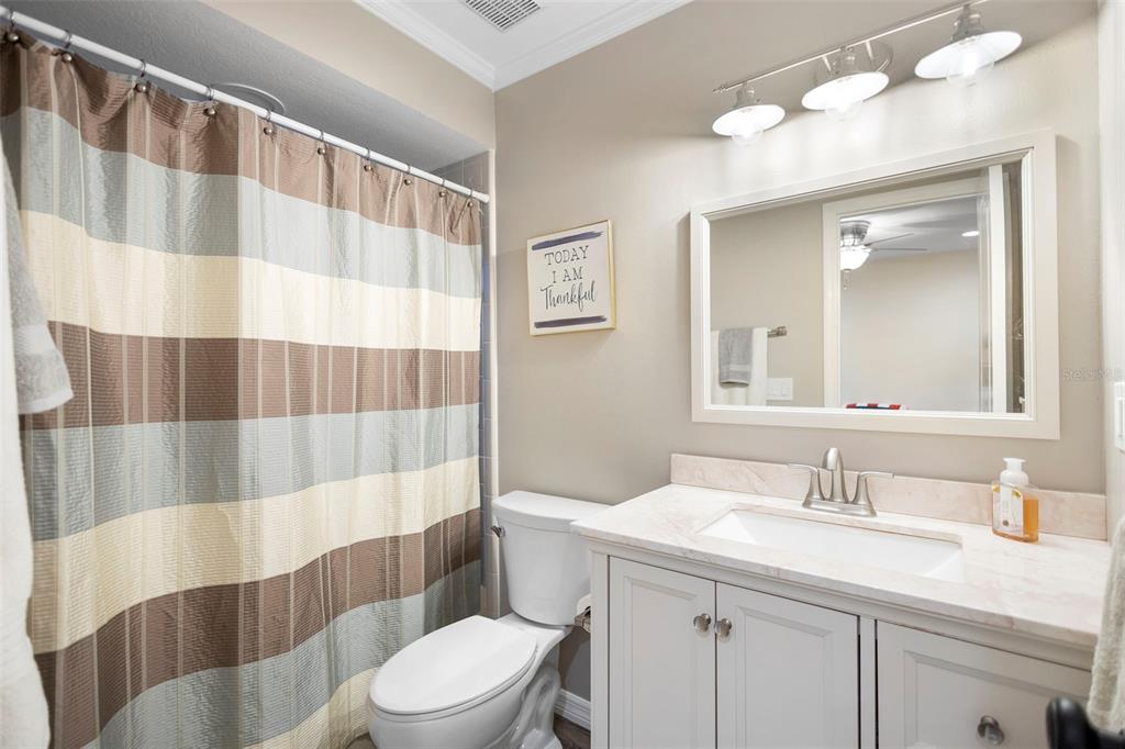 1777 Seneca Boulevard Winter Springs, FL 32708 - Photo 9 of 42 a bathroom with a sink a toilet a shower curtain and a mirror