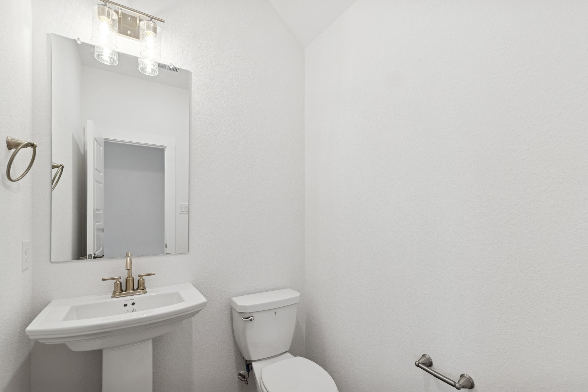 32503 Midsummer Drive Fulshear, TX 77441 - Photo 14 of 48 a bathroom with a sink mirror and toilet