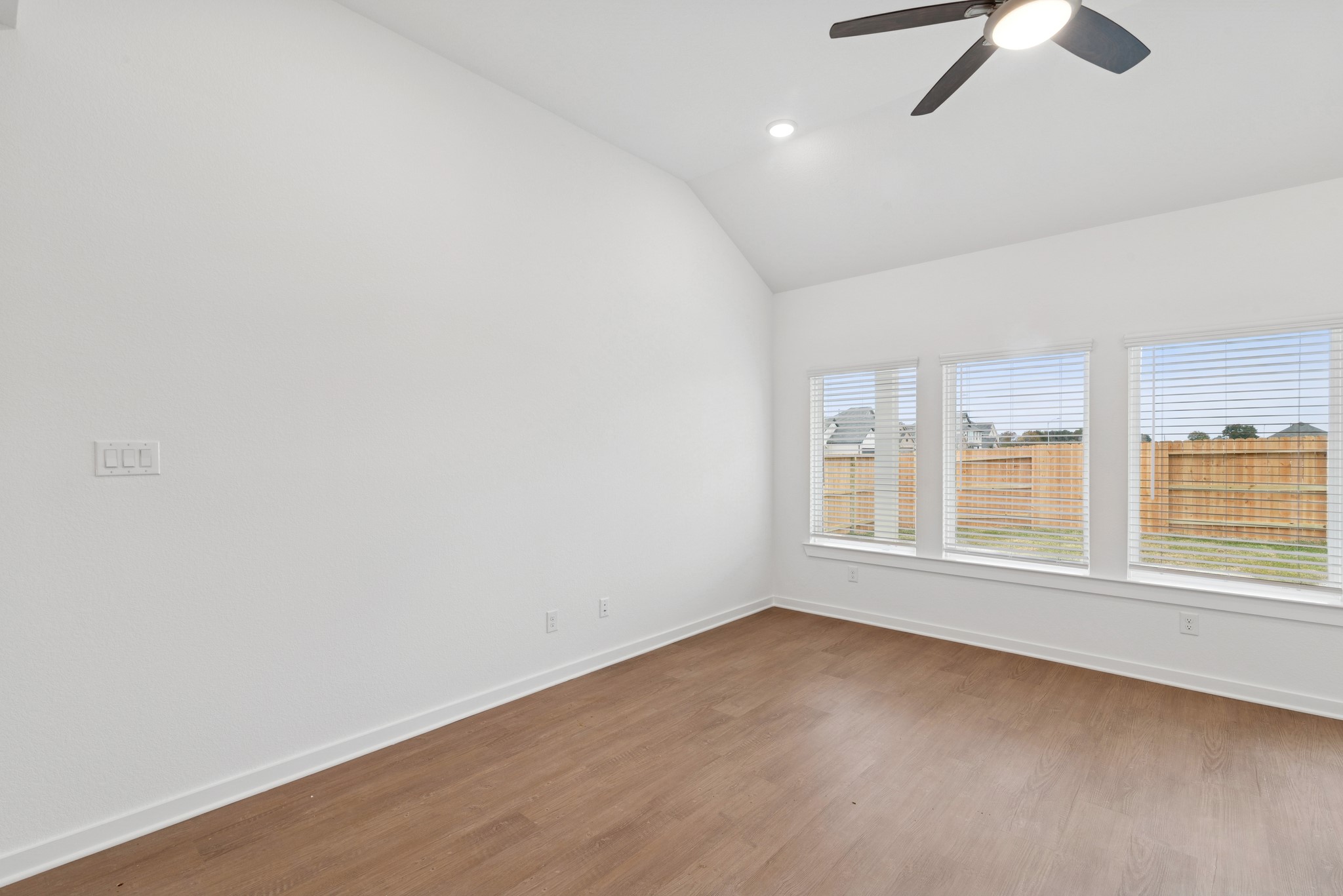 32503 Midsummer Drive Fulshear, TX 77441 - Photo 15 of 48 wooden floor in an empty room with a window
