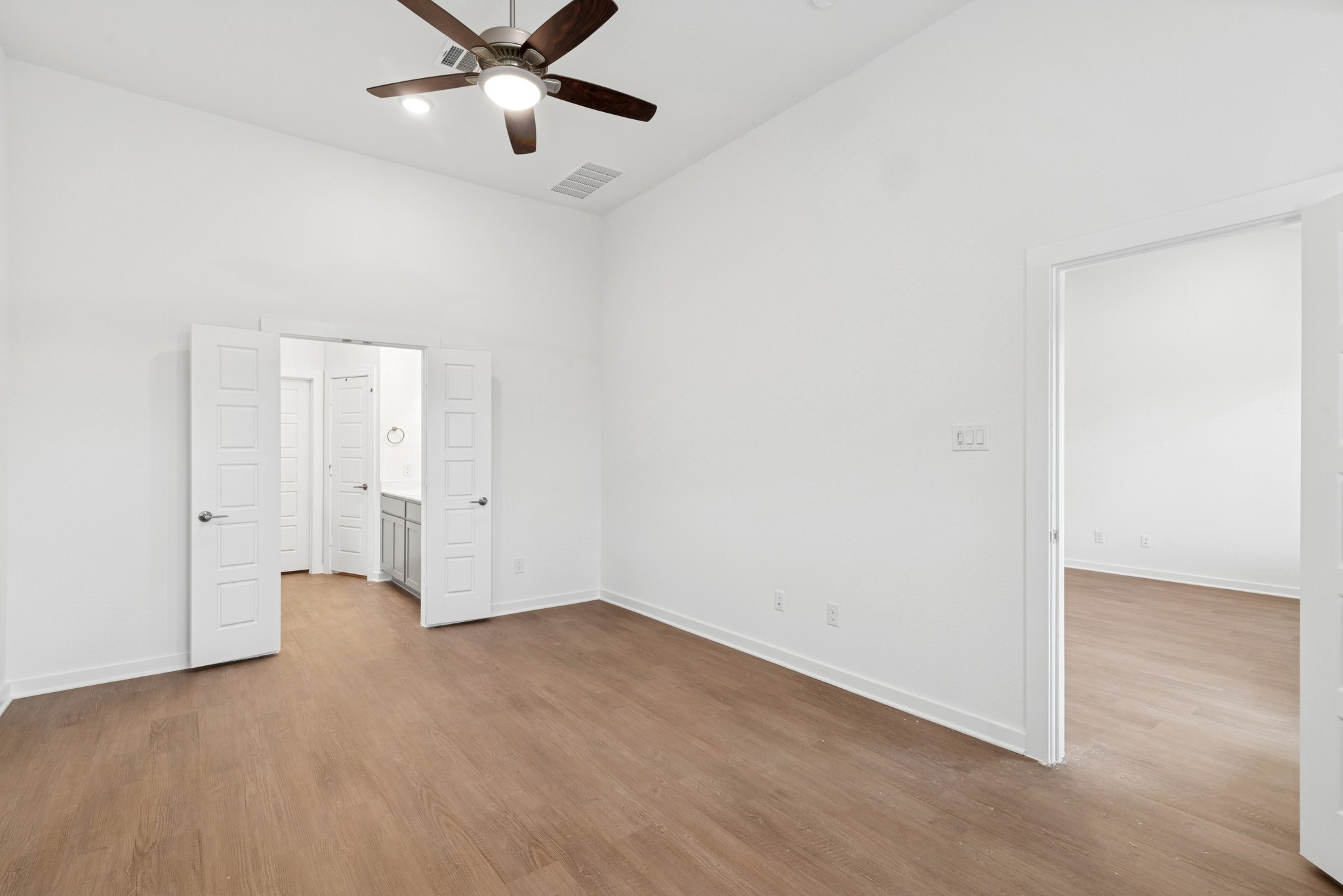 32503 Midsummer Drive Fulshear, TX 77441 - Photo 25 of 48 a view of an empty room with a ceiling fan