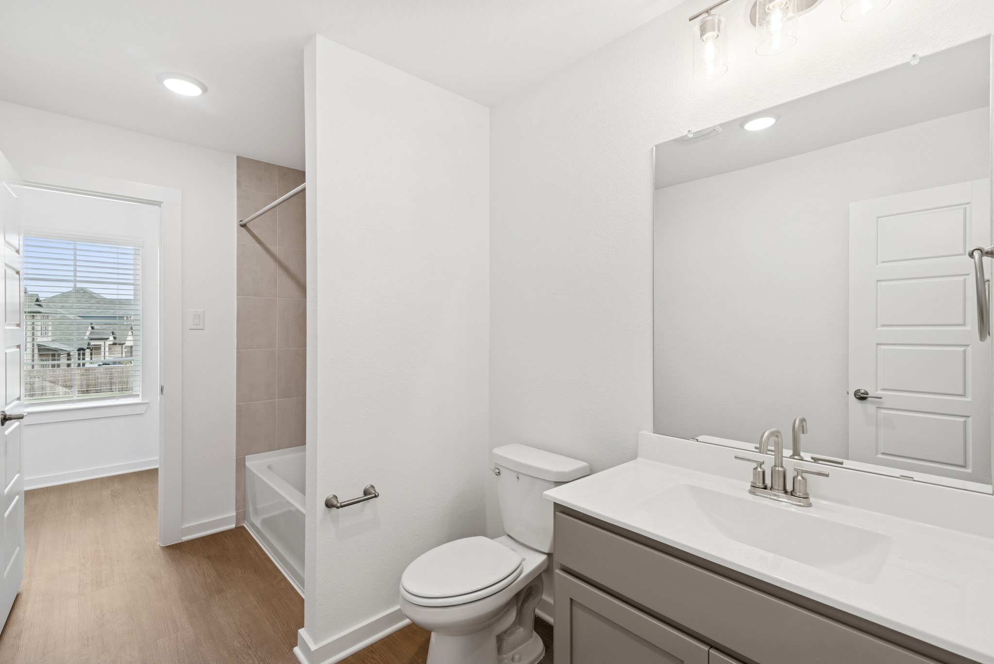 32503 Midsummer Drive Fulshear, TX 77441 - Photo 34 of 48 a bathroom with a sink toilet vanity and tub