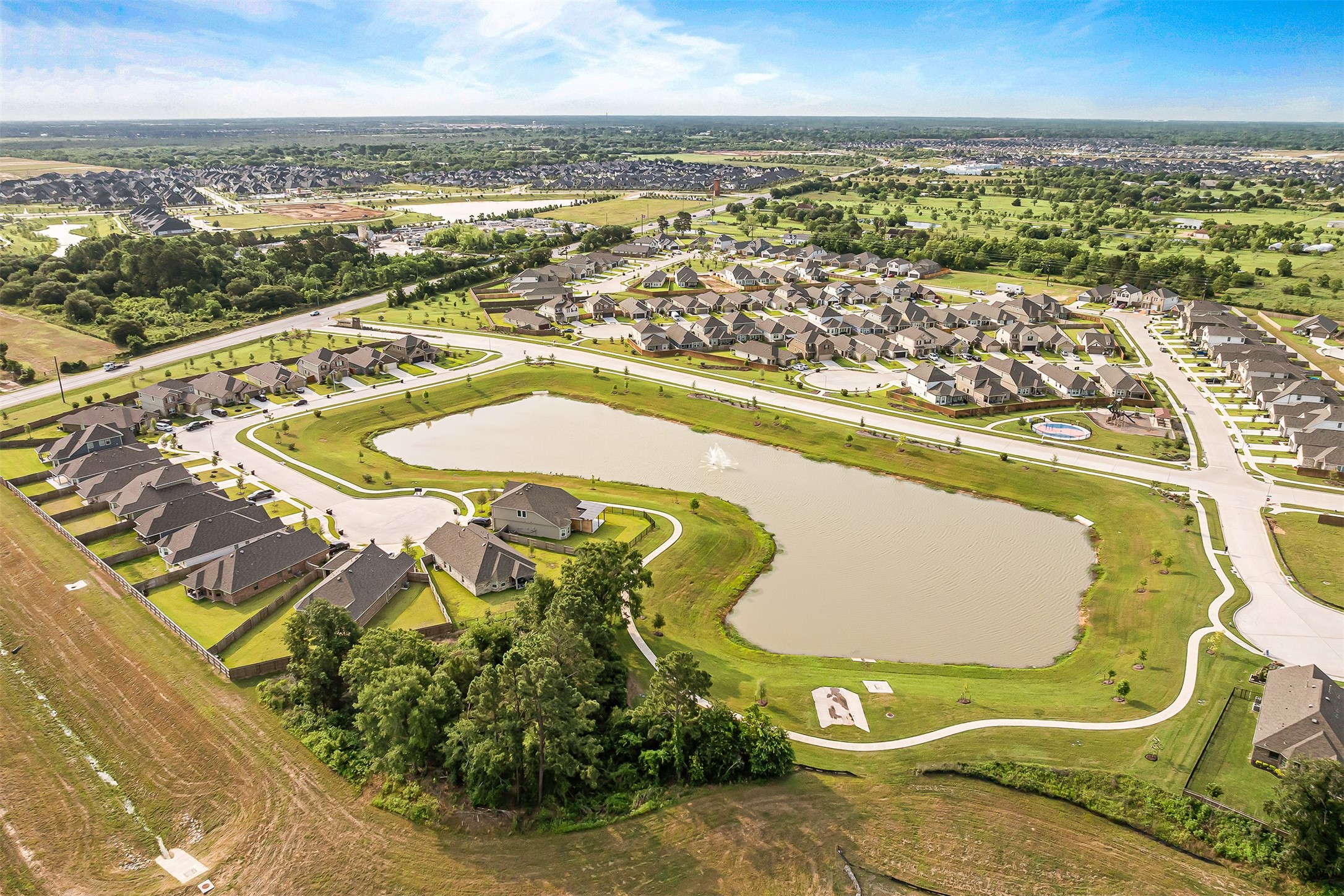 32503 Midsummer Drive Fulshear, TX 77441 - Photo 47 of 48 an aerial view of a swimming pool with outdoor seating