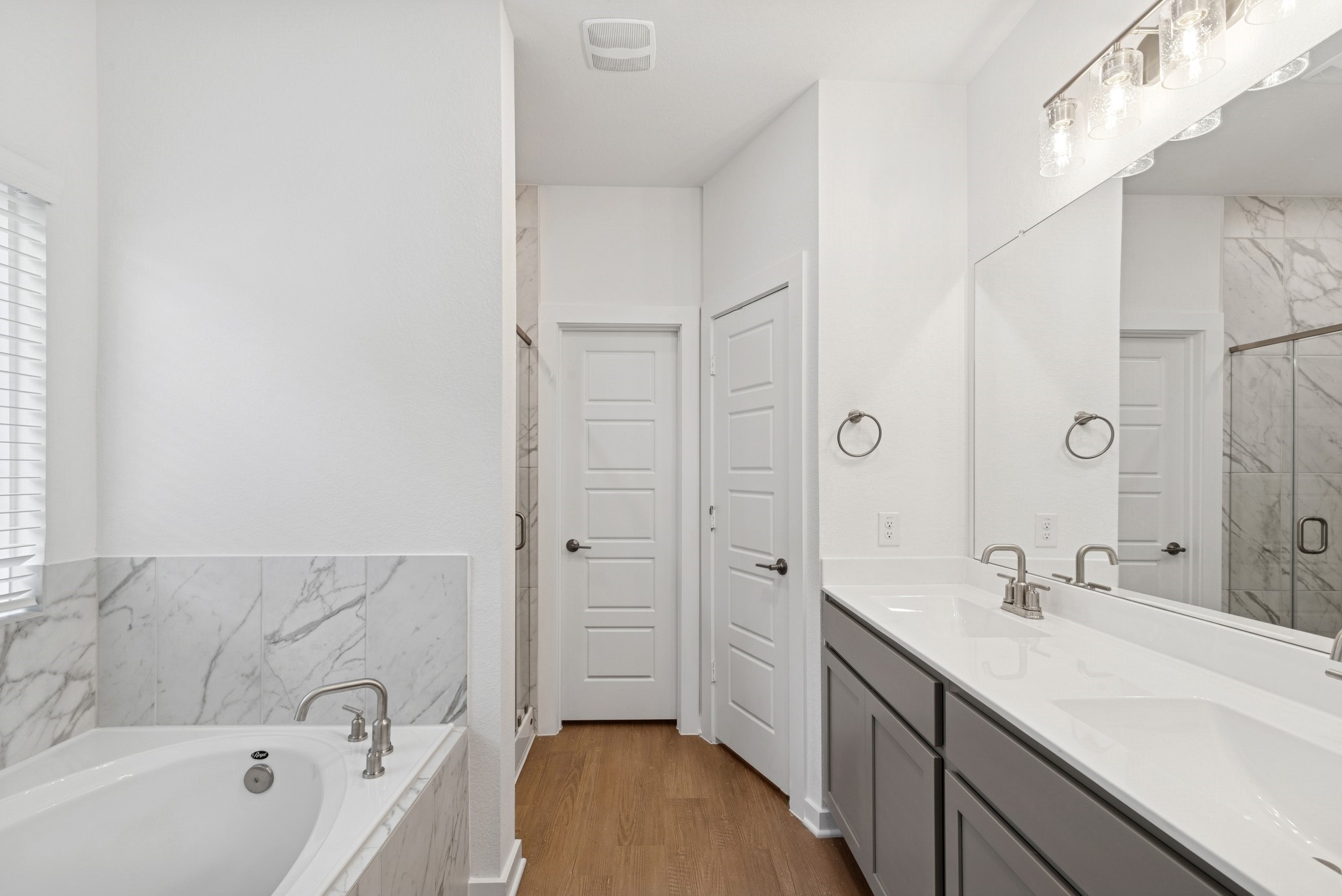 32503 Midsummer Drive Fulshear, TX 77441 - Photo 5 of 48 a spacious bathroom with a tub sink a mirror and a shower