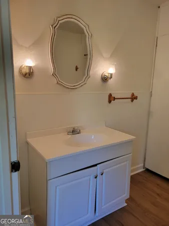 a bathroom with a sink and a mirror