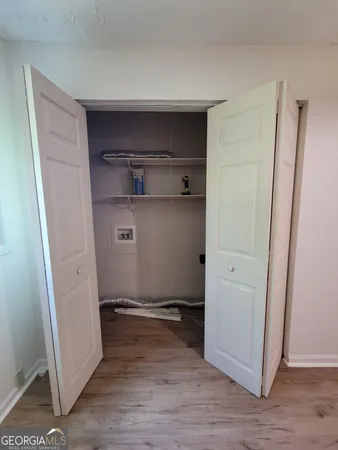 a swimming pool with an outdoor space and seating area