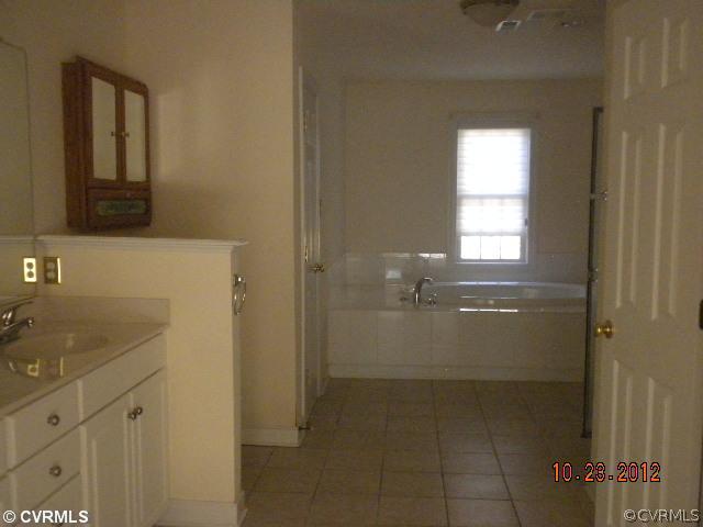 4315 Broad St Road Gum Spring, VA 23065 - Photo 9 of 10 a bathroom with a bathtub