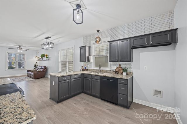 a kitchen with sink cabinets and window