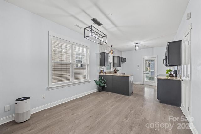 a view of living room filled with furniture and a window