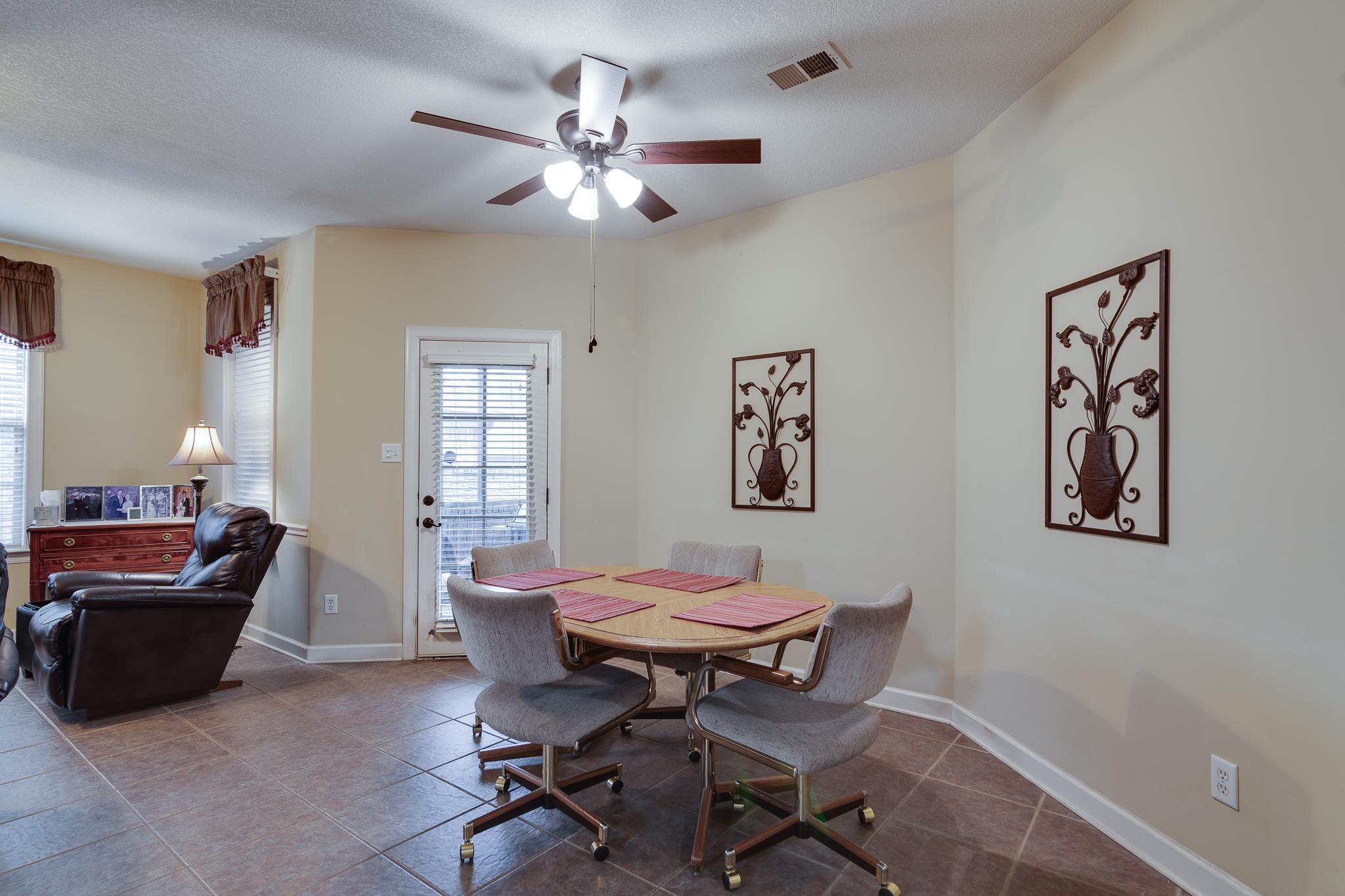 5350 Evergreen Road Lakeland, TN 38002 - Photo 11 of 24 Tiled dining area with a textured ceiling and ceiling fan