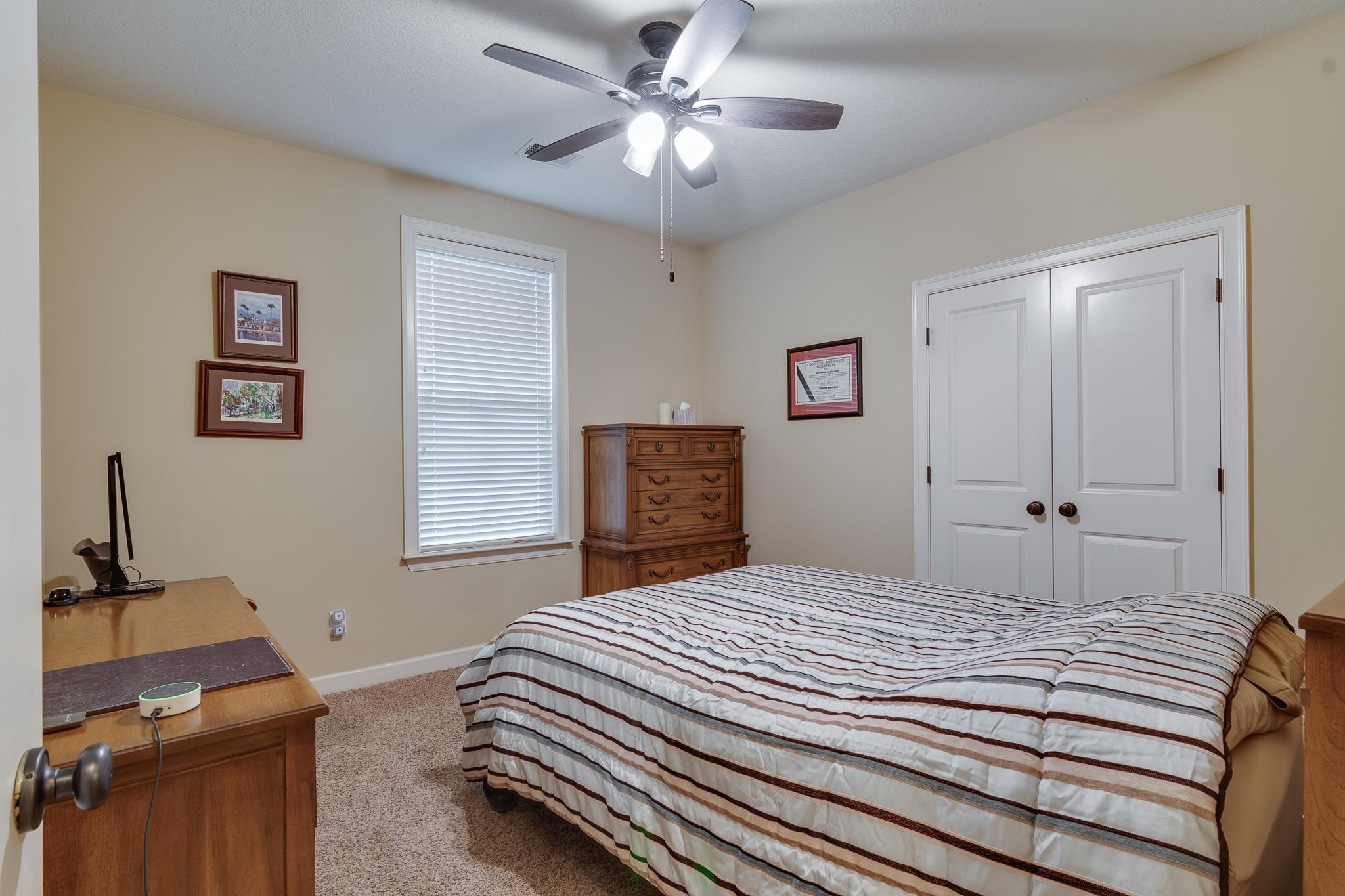 5350 Evergreen Road Lakeland, TN 38002 - Photo 18 of 24 Bedroom featuring light carpet, a closet, and ceiling fan
