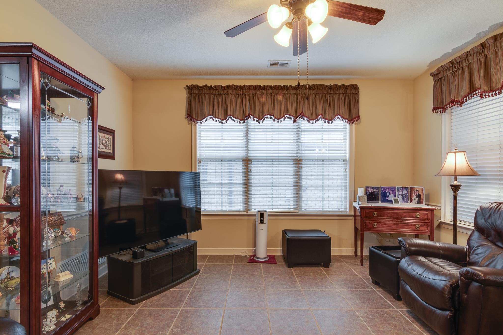 5350 Evergreen Road Lakeland, TN 38002 - Photo 9 of 24 Living room with ceiling fan and tile patterned flooring
