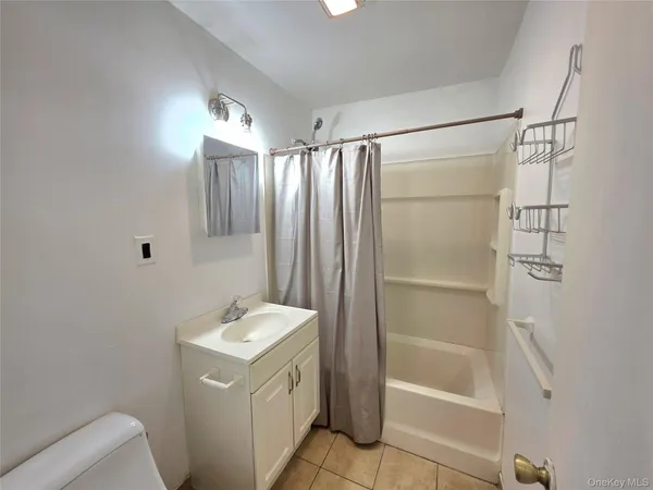 a kitchen with white cabinets and white stainless steel appliances