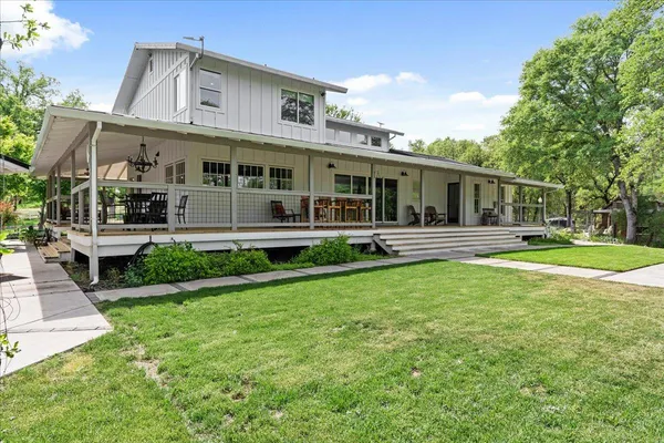a view of a house with a yard porch and sitting area