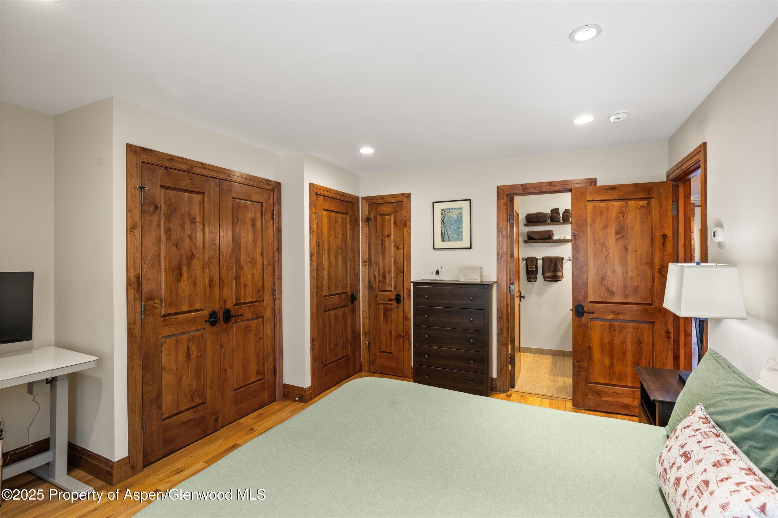 35 Lower Woodbridge Road, Unit W 184 Snowmass Village, CO 81615 - Photo 17 of 32 a bedroom with furniture and a closet
