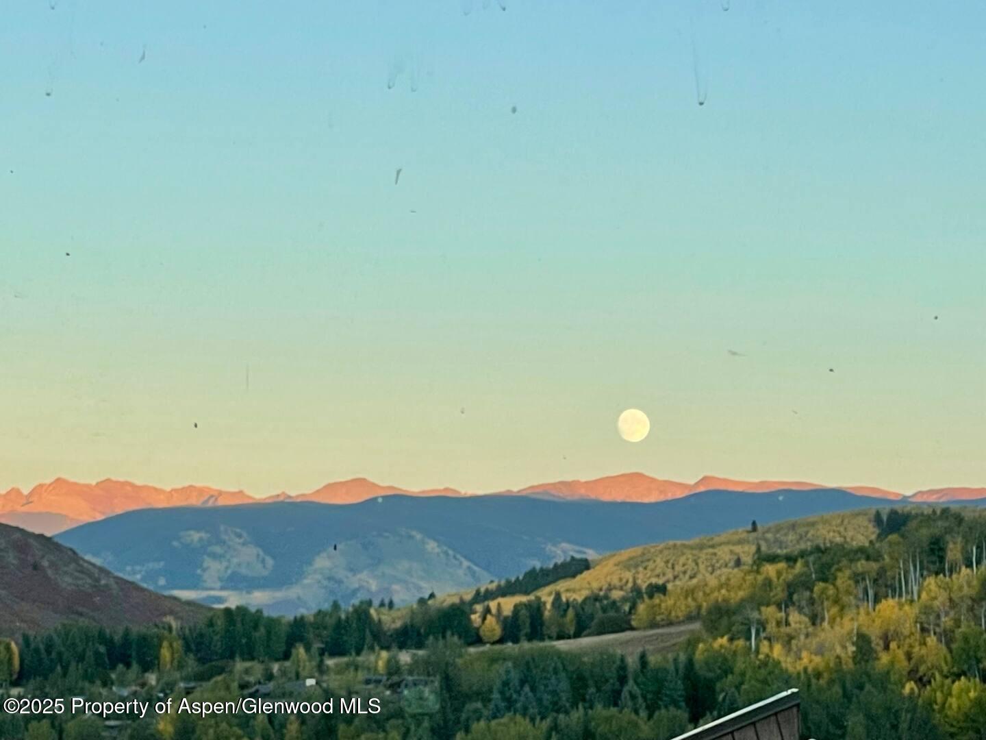 35 Lower Woodbridge Road, Unit W 184 Snowmass Village, CO 81615 - Photo 26 of 32 a view of a mountain in the distance in a field