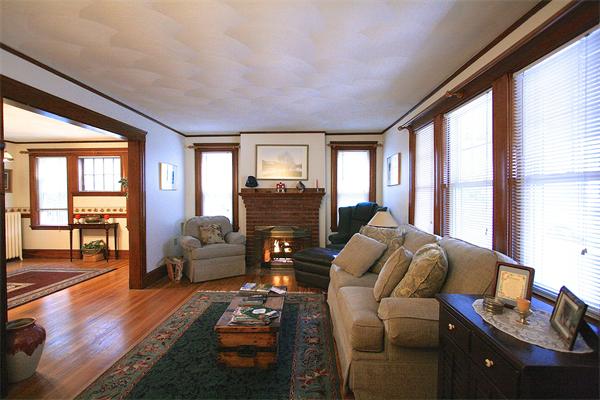 8-10 Robbins Road Arlington, MA 02476 - Photo 6 of 10 a living room with furniture and a flat screen tv with wooden floor