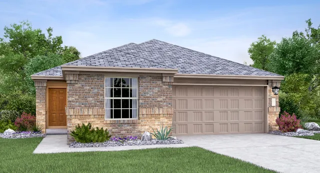 a front view of a house with a garden and yard