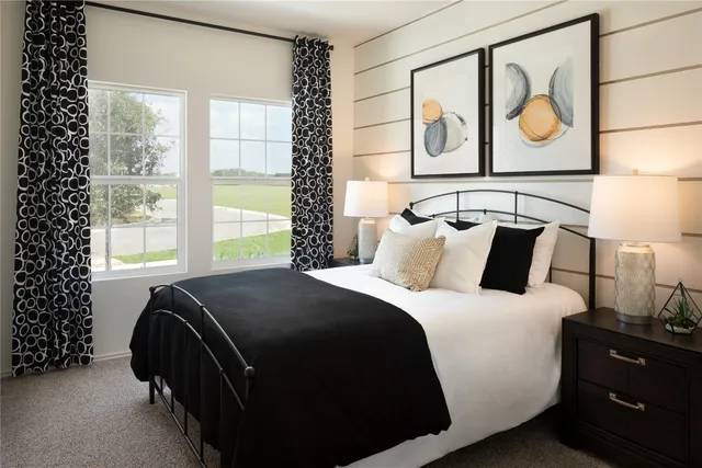 a bedroom with a bed and window