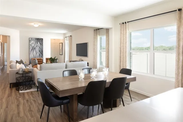 a kitchen with stainless steel appliances a sink a stove a microwave and cabinets