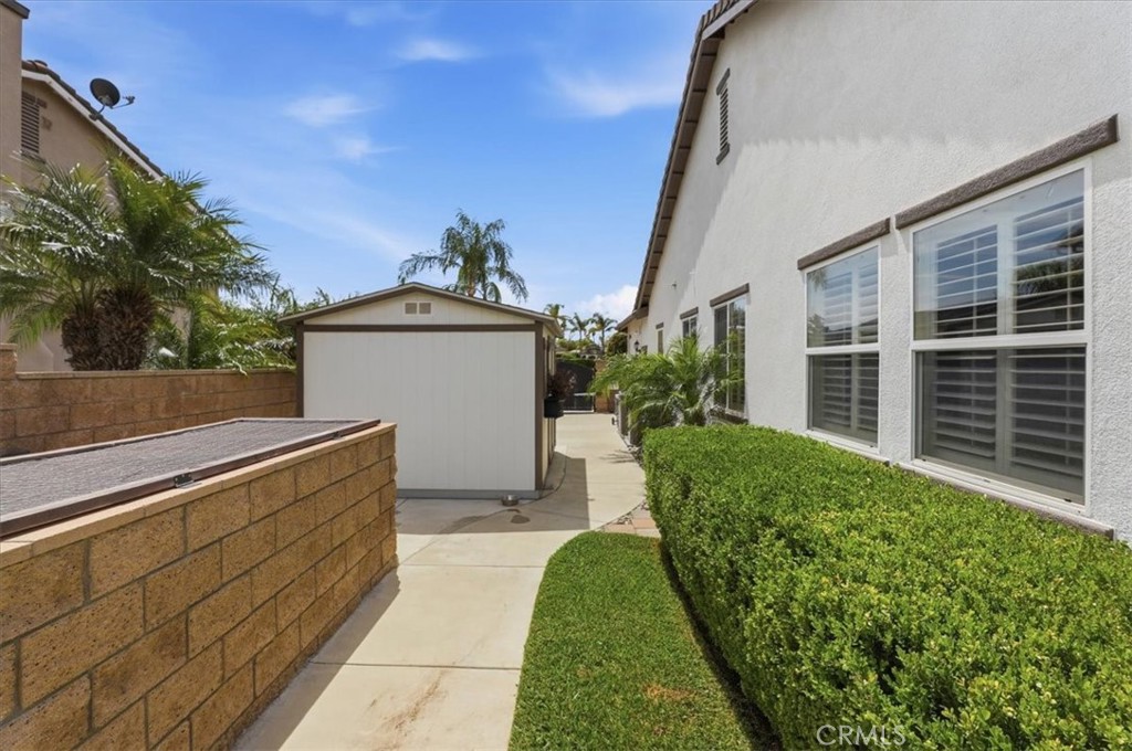 1125 Pamplona Drive Riverside, CA 92508 - Photo 35 of 42 Side yard with storage shedd and pool equipment