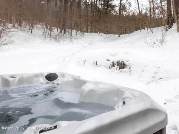 a view of snow on the side of a road
