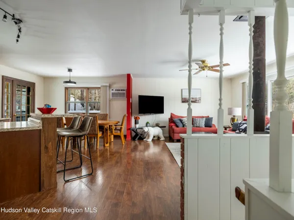 a living room with furniture rug and window