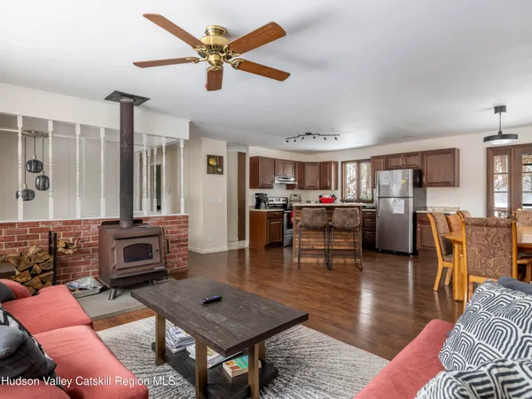 a kitchen with stainless steel appliances granite countertop a stove sink and cabinets