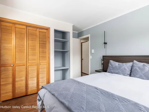 a living room with furniture a rug and a large window