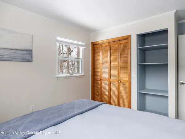 a living room with furniture a chandelier and a fireplace