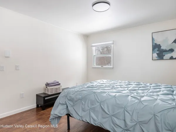 a living room with furniture a rug and a table